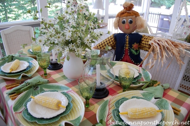Summer Table Setting with Corn Chargers and Plaid Tablecloth
