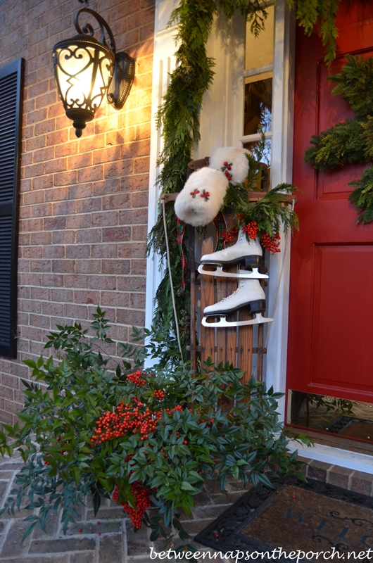 Decorating the Porch for Christmas with Garland, Sled, Ice Skates, Muff and Snowflake Wreath Decorating the Porch for Christmas with Garland, Sled, Ice Skates, Muff and Snowflake Wreath