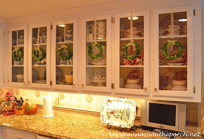 Decorate Kitchen Cabinets with Preserved Boxwood Wreaths for Christmas