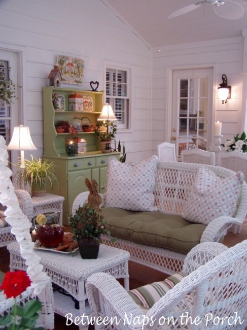 Screened in Porch with White Wicker Furniture