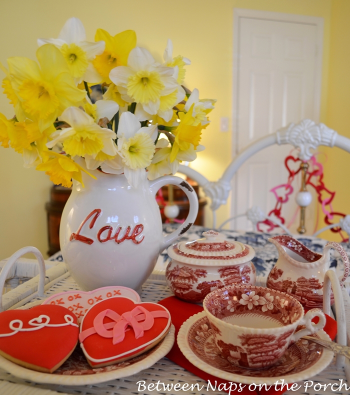 Daffodils in Love Pitcher With Heart Cookies On Valentine's Day