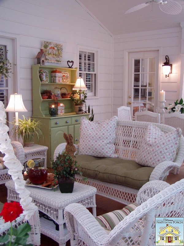 Screened Porch with White Wicker Furniture