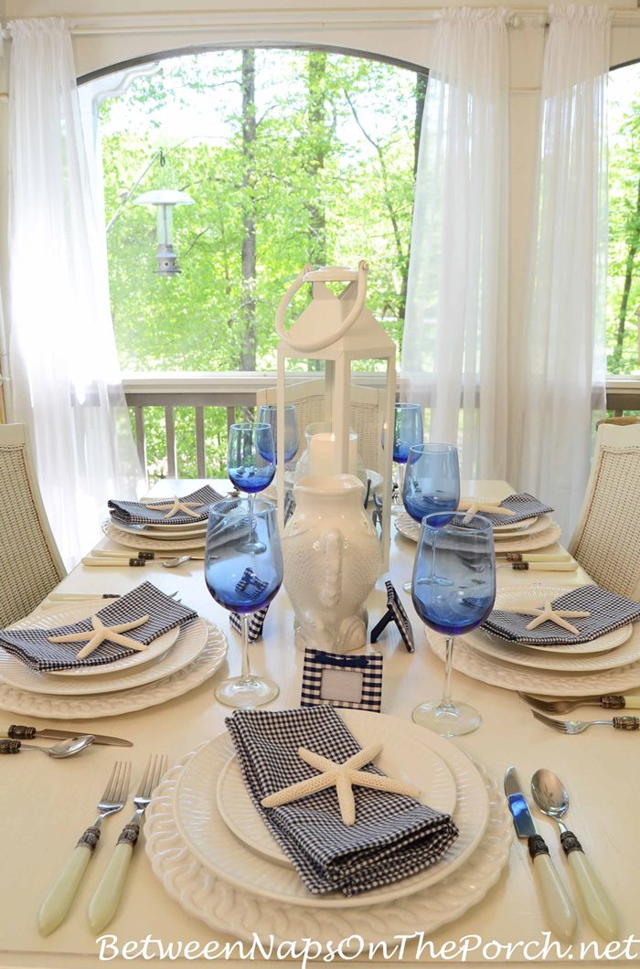 Blue and White Table With Check Place Card Holders and Napkins