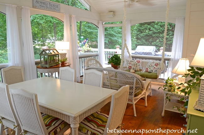 Screened-In Porch with White Wicker Furniture