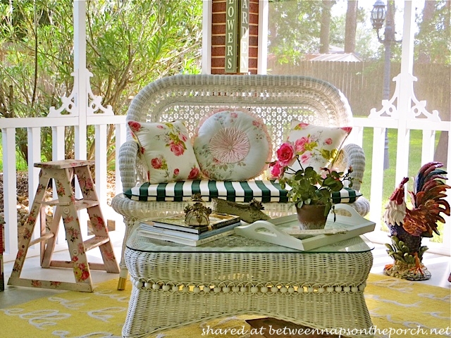 Victorian Screened Porch with white wicker settee