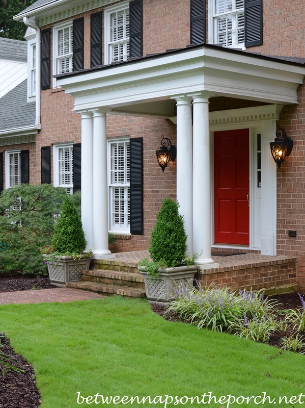 Boxwood Topiaries in Lattice Planters with Annuals for Traditional Landscape