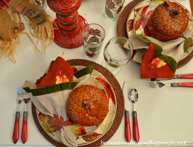 Fall Table Setting with Leaf Themed Dishware and Napkins