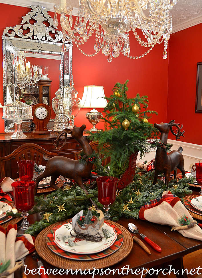 Christmas Table Setting Tablescape with Plaid Plates and a Natural Greenery Centerpiece