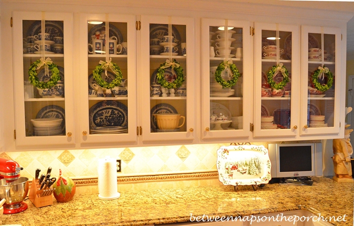 https://betweennapsontheporch.net/wp-content/uploads/2013/12/Hang-Wreaths-on-Glass-Door-Kitchen-Cabinets.jpg