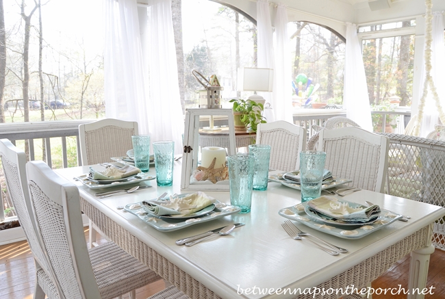 Beach Table Setting with Shell and Sailboat Plates