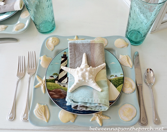 beach themed table setting tablescape with lighthouse