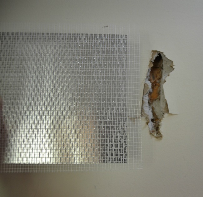 How to repair large drywall hole