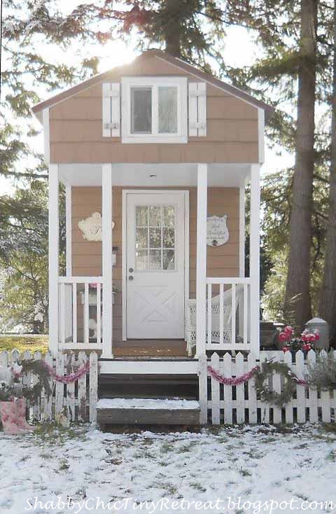 White Picket Fence Decorated with Wreaths and Garland for a Cottage Home