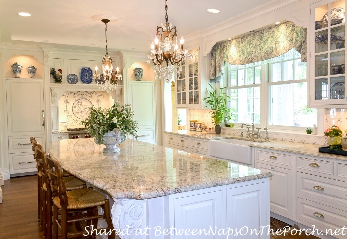 White Kitchen with Granite Counters & Chandeliers