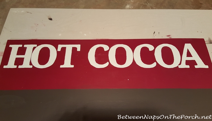 Painting Hot Cocoa Lettering onto Sign