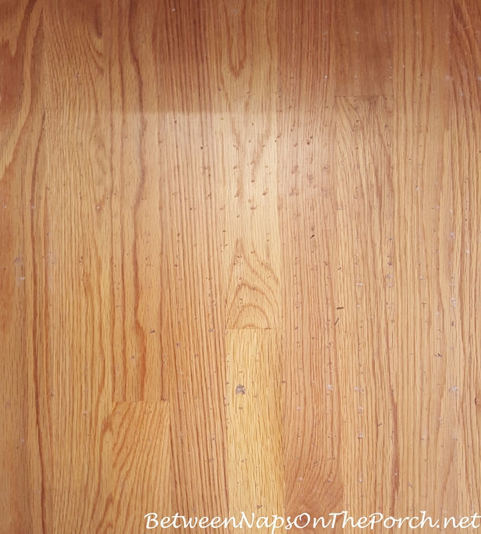 Damaged Hardwood Flooring from Latex or rubber backing on rug