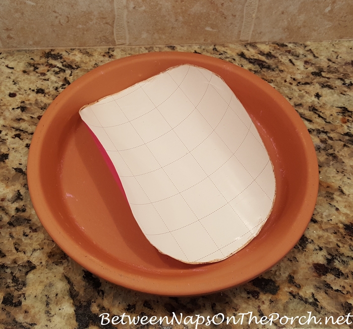 Easy way to find center of terra cotta clay saucer