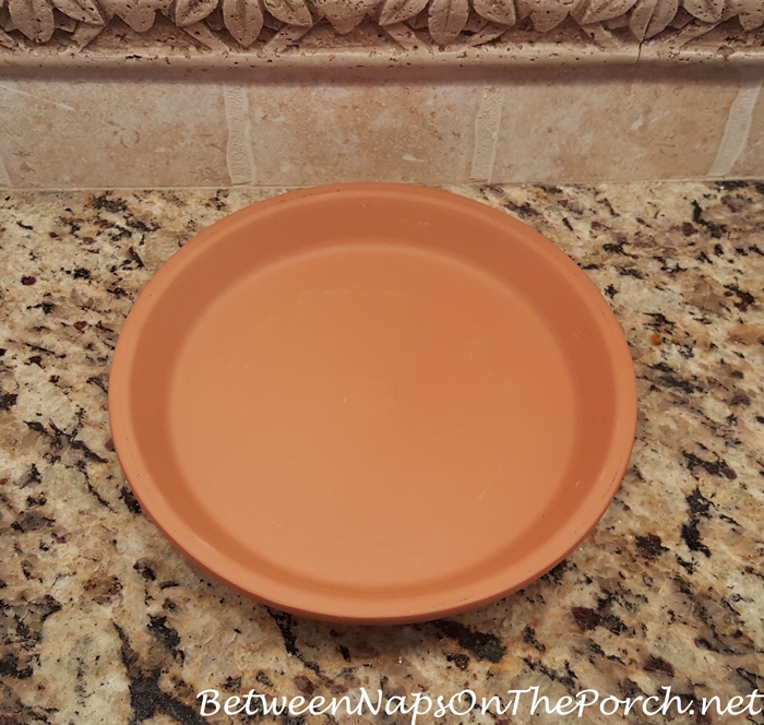 How to find the center of a terra cotta saucer