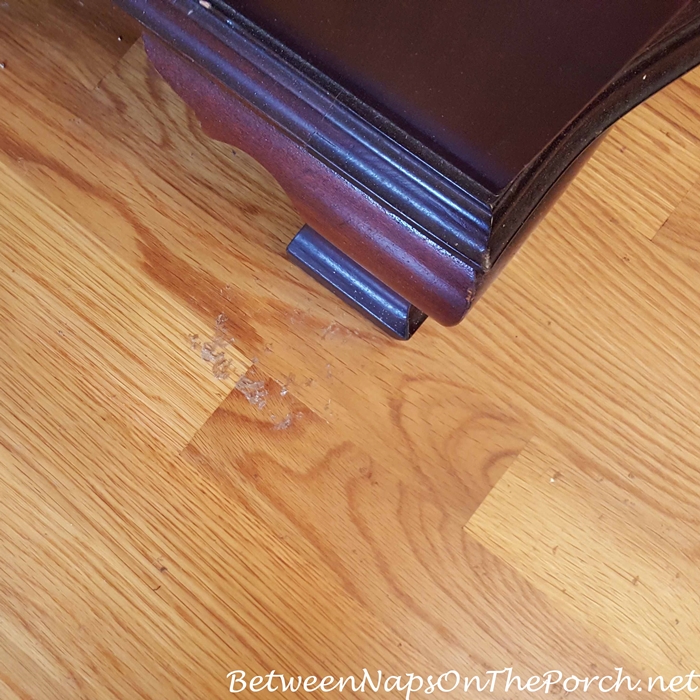 Latex rubber stuck to hardwood flooring from deteriorating rug backing