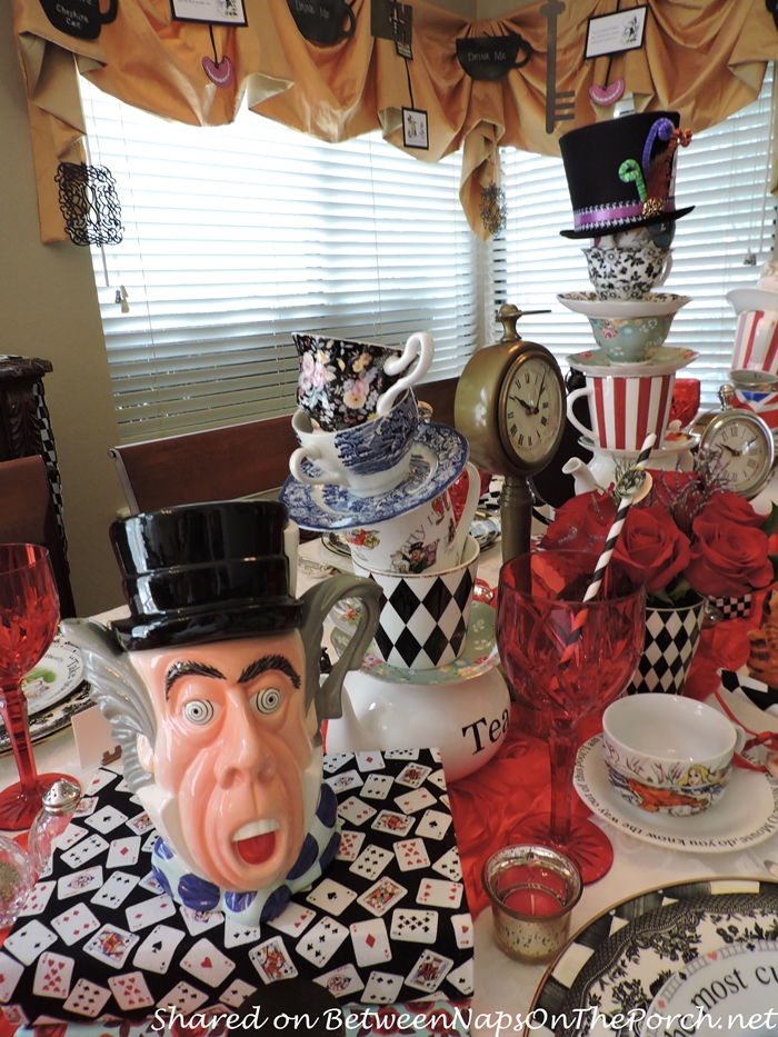 https://betweennapsontheporch.net/wp-content/uploads/2016/09/DIY-Tipsy-Teacup-Towers-Mad-Hatter-Tea-Pot-for-Alice-in-Wonderland-Mad-Hatter-Party.jpg