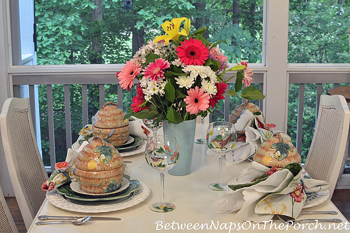 https://betweennapsontheporch.net/wp-content/uploads/2017/05/Porch-Spring-Table-with-Bee-Skep-Tureens.jpg