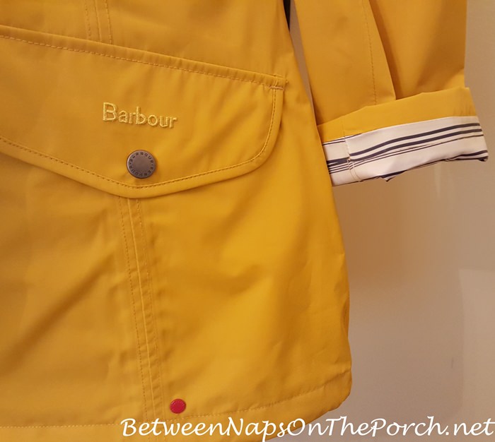 Yellow Barbour Trevose Waterproof Jacket, Striped Lining Visible with Sleeve Turned Up