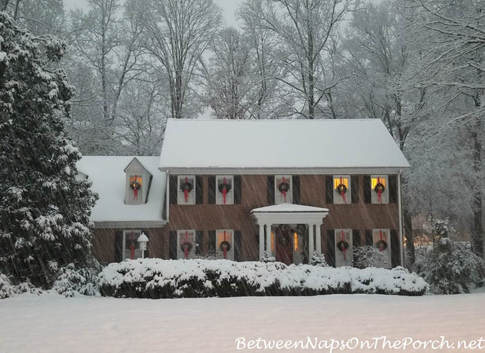 Christmas House with Wreaths in Snow