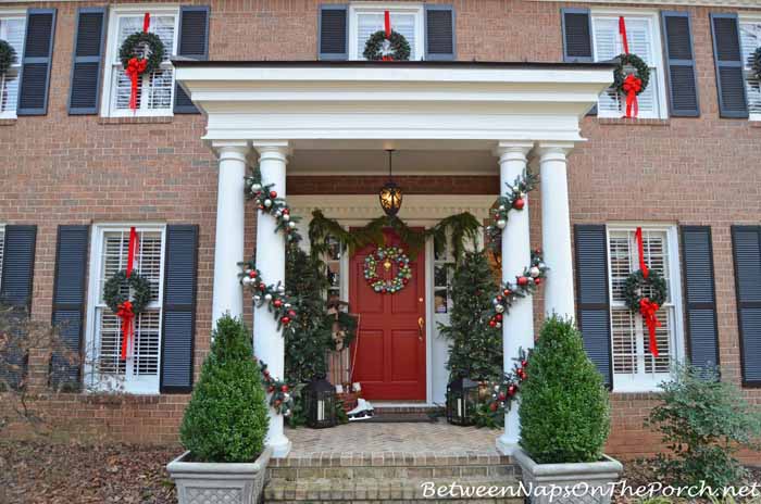 Decorate Porch For Christmas with Lit Topiary Trees