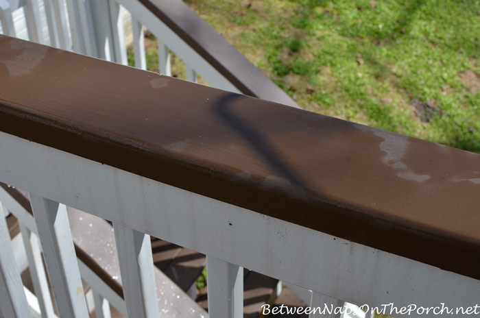 Cleaning Away Bird Droppings on Brown Deck Rails