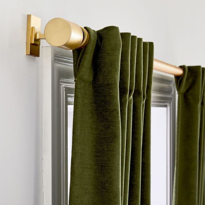 Worn velvet curtains tarragon green color