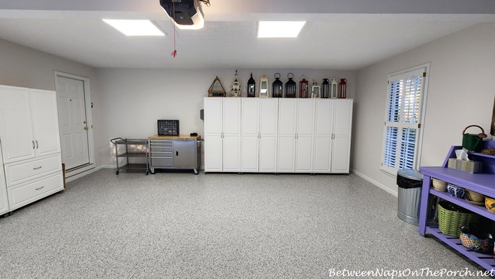 https://betweennapsontheporch.net/wp-content/uploads/2022/08/Garage-Makeover-with-New-Flooring-Lighting-and-Paint.jpg