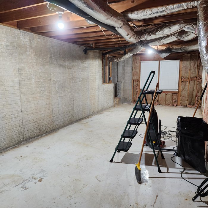 Basement Storage Crawl Space Lit By Bare Light Bulbs Stock Photo