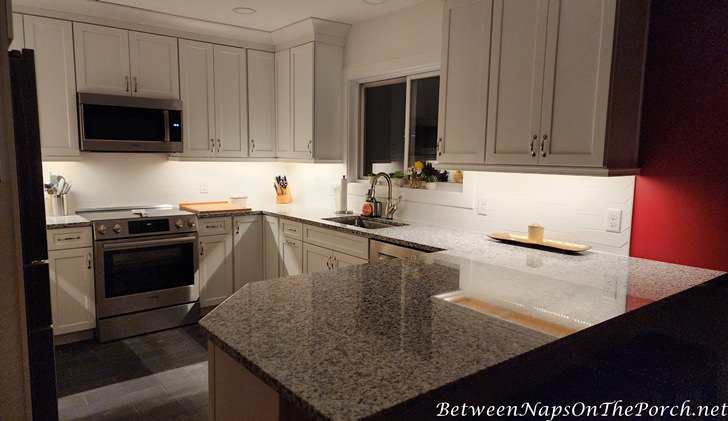 Kitchen with White Cabinet, White Backsplash, Granite Counters