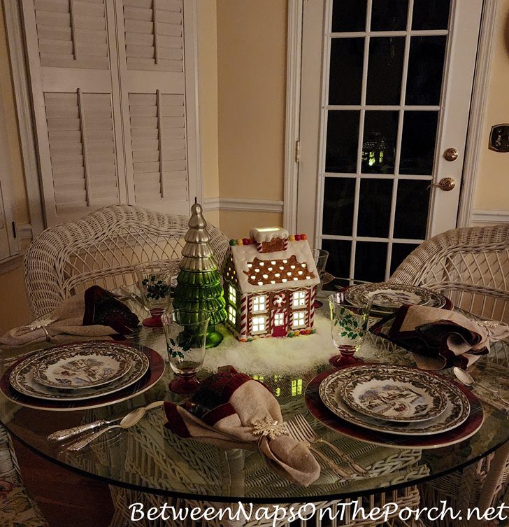 Christmas Table with Lit Gingerbread House Centerpiece