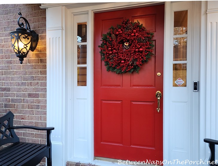 Red door with fresh wreath
