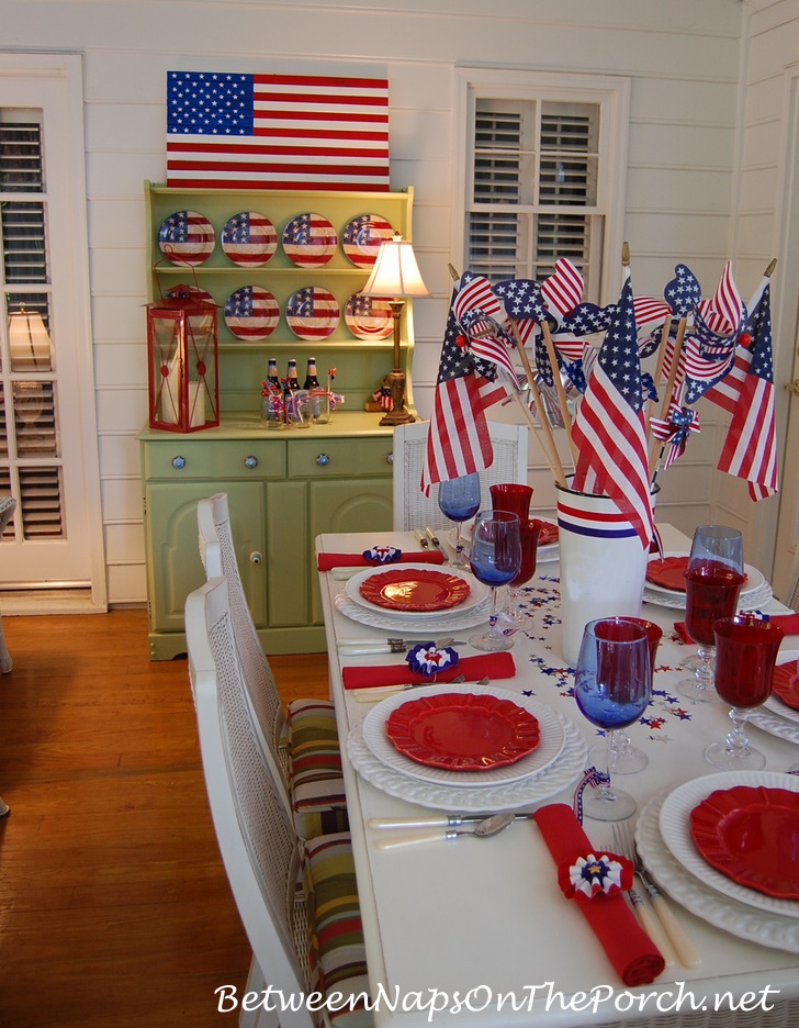 DIY Wooden Flag on a porch decorated for 4th of July