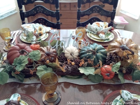 https://betweennapsontheporch.net/wp-content/uploads/adthrive/2023/11/Thanksgiving-Table-Setting-with-Pumpkin-and-Gourd-Plates-Pumpkin-Centerpiece-5-480x360.jpg