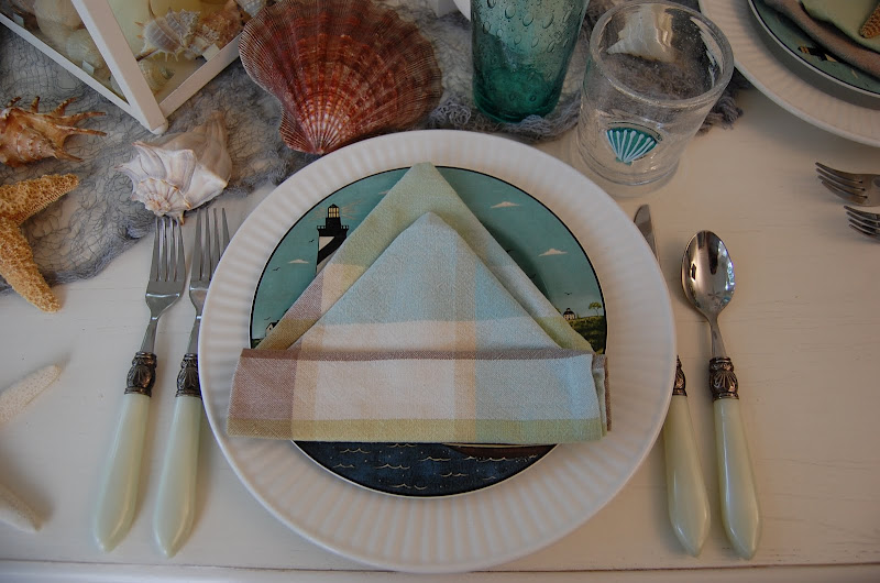 Beach Themed Table Setting with Sailboat Napkin Fold