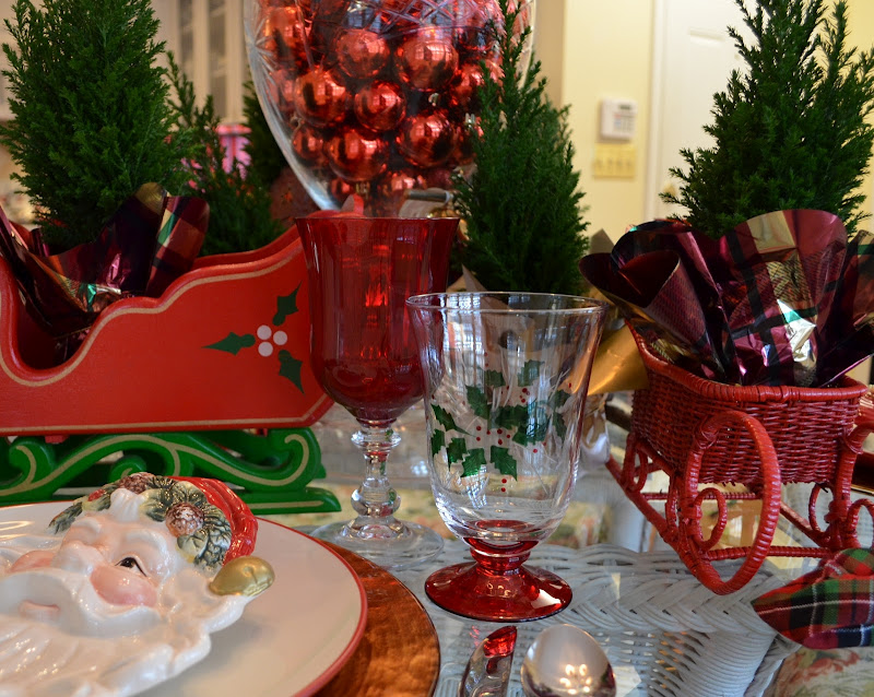 A Christmas Table Setting Tablescape with a Santa Claus Theme