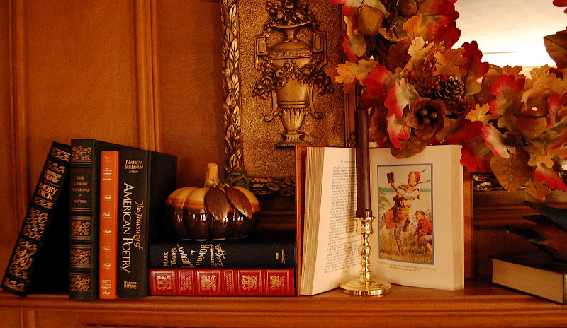 Decorate a fireplace mantel for Fall or Autumn with Books, Pumpkins and a fall wreath