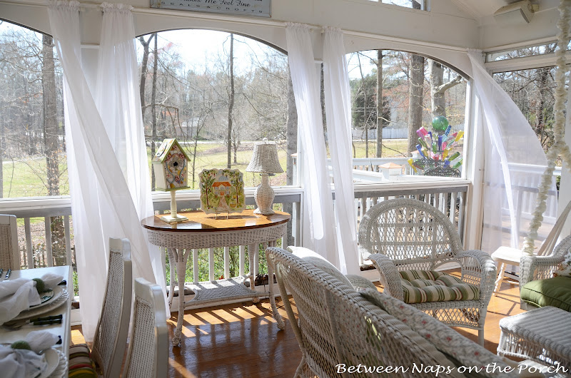 Windy day on the Porch with curtains blowing in the breeze