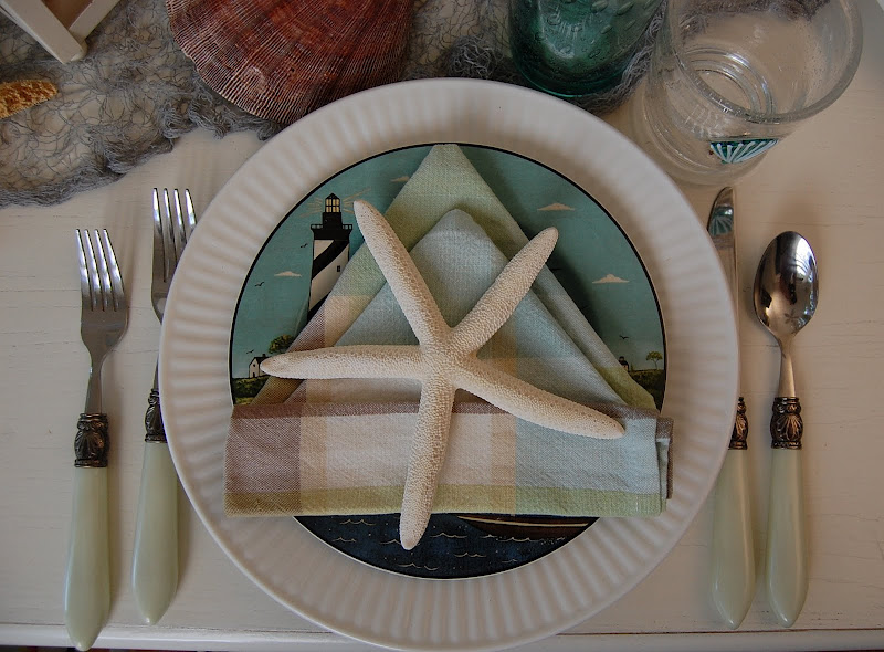 Beach Themed Table Setting with Sailboat Napkin Fold