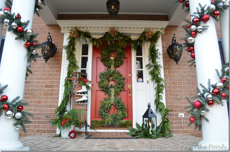 Christmas Porch With Triple Wreaths Between Naps On The Porch