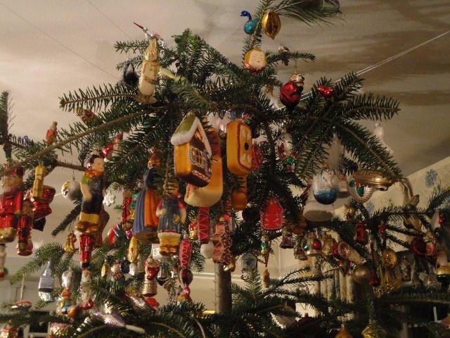 A Christmas tree overloaded with a hodgepodge of sentimental ornaments  accumulated over the years